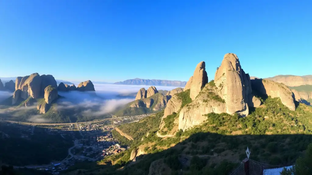Meteora rock pillars above Kalambaka with morning mist in the valley